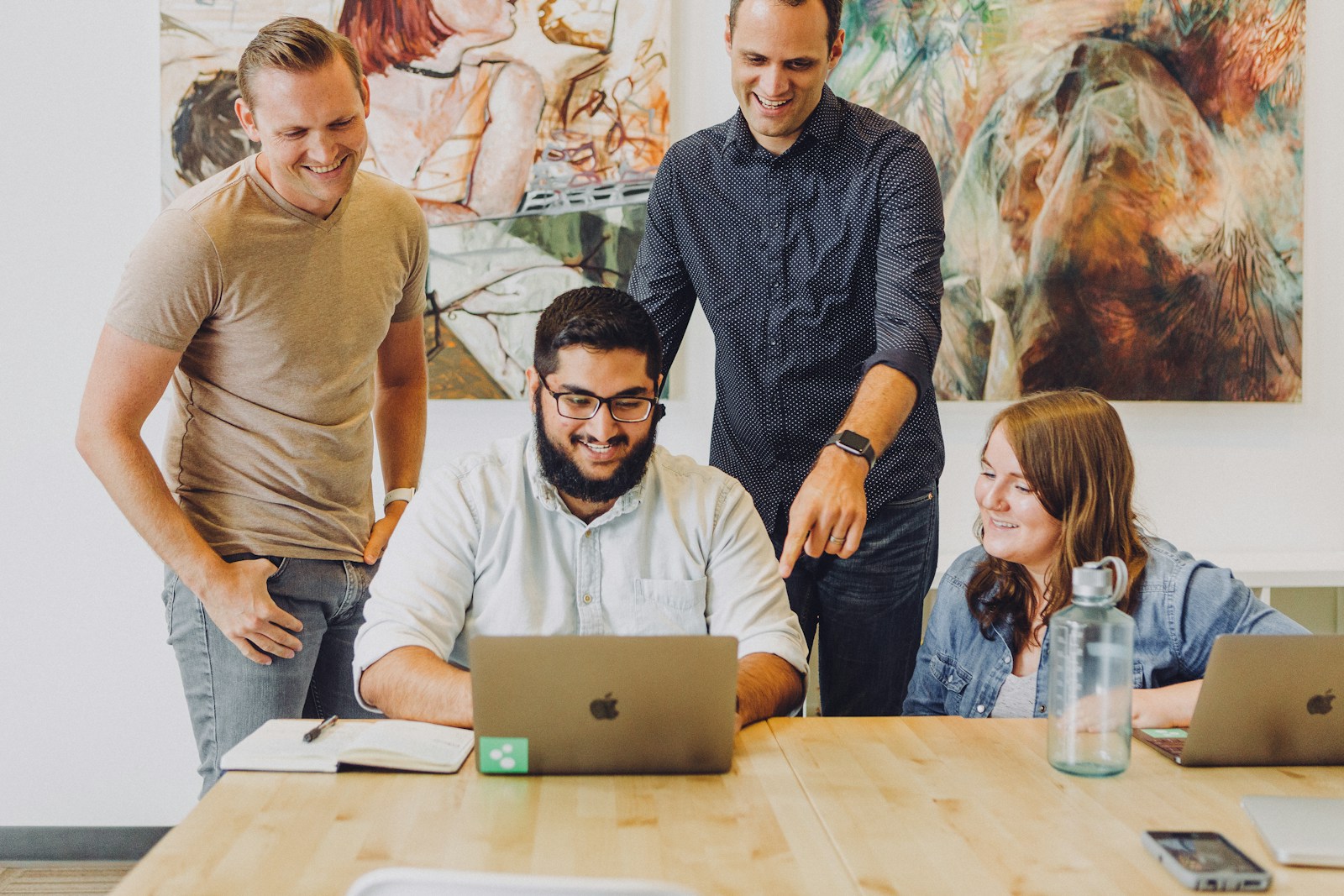 Professional team discussing ideas around a table