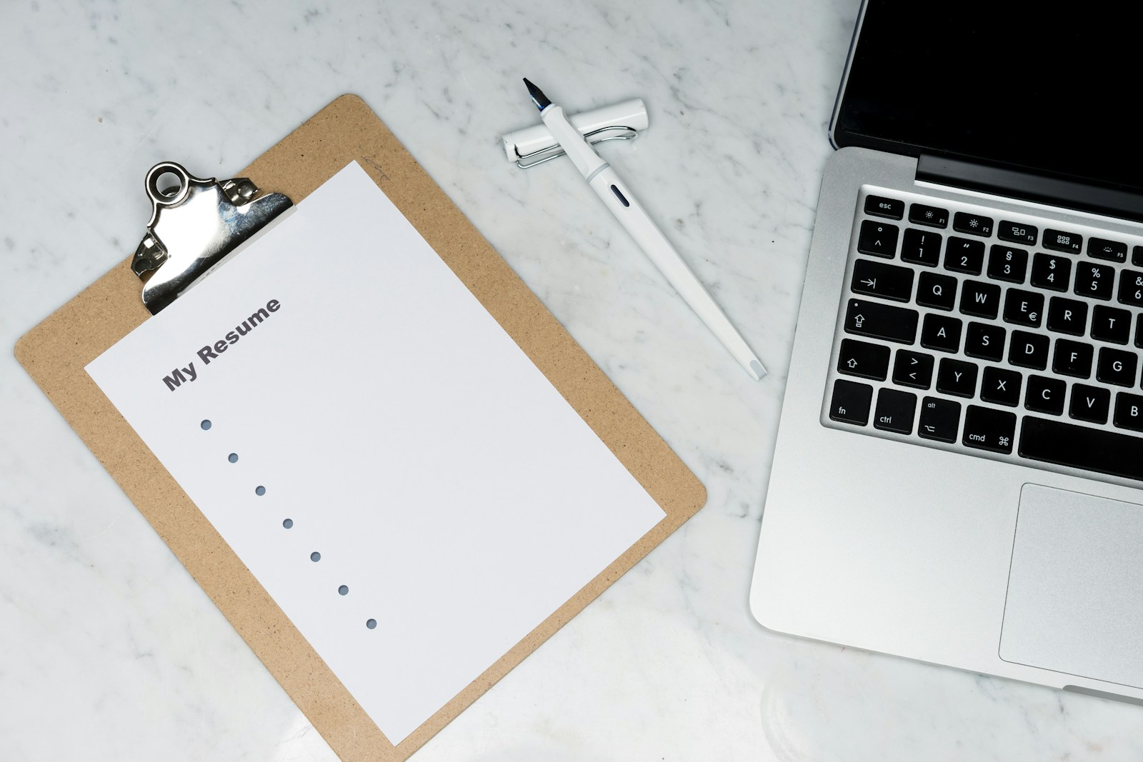 Printed résumé and notebook used to prepare a job application